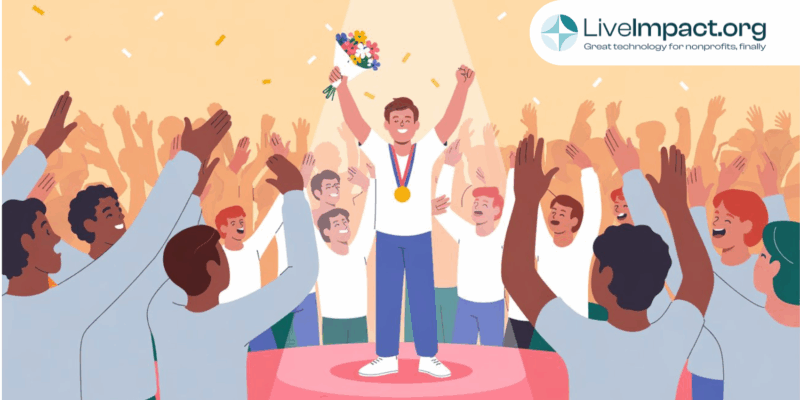 Illustration of a man standing on a podium with a medal and flowers, celebrating with raised arms as a cheering crowd surrounds him, symbolizing recognition and success. LiveImpact.org logo is shown in the corner.